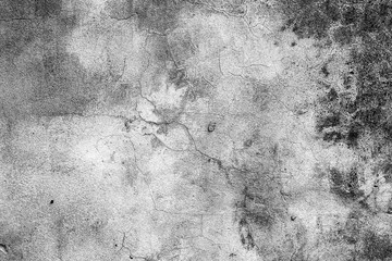 Texture of a concrete wall with cracks and scratches which can be used as a background