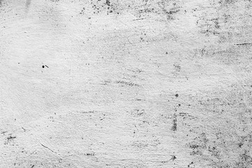 Texture of a concrete wall with cracks and scratches which can be used as a background