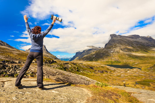 Happy tourist looking at mountains nature, Norway