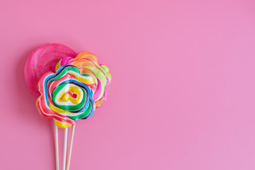 three Lollipop on a pink background, copy space