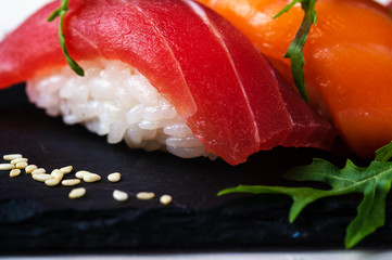 fresh sashimi with green on wooden table