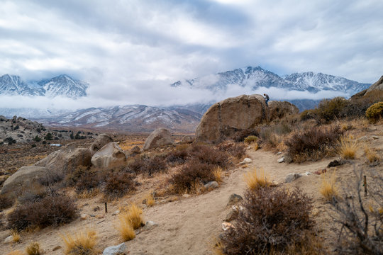 Climbers on highball boulders in the Buttermilks near Bishop, California