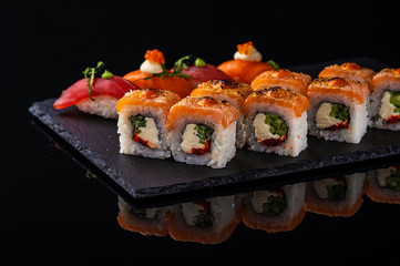 fresh sashimi with green on wooden table