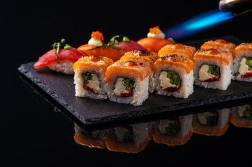 fresh sashimi with green on wooden table