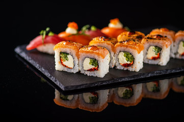fresh sashimi with green on wooden table