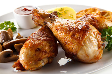 Barbecue chicken drumsticks with boiled potatoes and mushrooms
