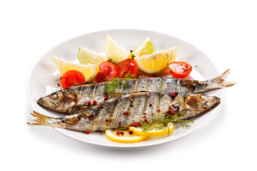 Fish dish - grilled herrings with vegetables