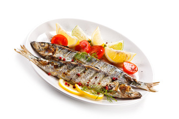 Fish dish - grilled herrings with vegetables