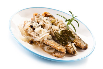Fried herrings in vinegar on white background