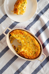 Homemade Cheddar Corn Pudding Casserole, top view. Flat lay, overhead, from above.