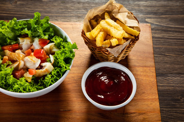 Fried cod and vegetables with french fries