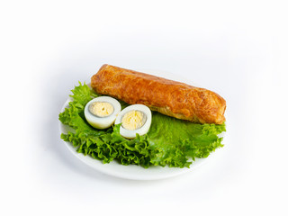 Roll of thin wheat tortillas stuffed with chicken breast, fresh vegetables, sauce and mozzarella, served with lettuce and boiled egg