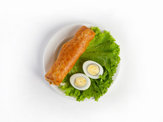 Roll of thin wheat tortillas stuffed with chicken breast, vegetables and mozzarella cheese, served with lettuce and boiled egg