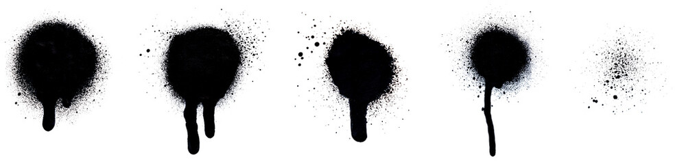 Close-up of several black spray paint spots, splashes and drips, isolated on white background.