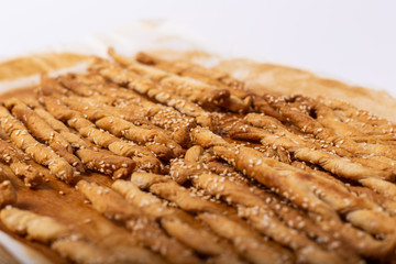 Homemade puff pastry sticks with sesame seeds