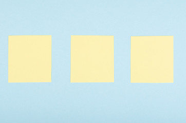 Paper notes composition on blue background. Flat lay.