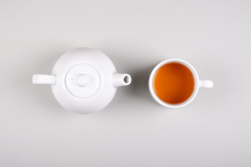 Obraz na płótnie Canvas Tea cup composition on gray background. Flat lay.