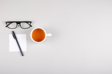 Tea cup composition on gray background. Flat lay.