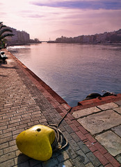 Yellow cordage point, Chalkida city harbor in Evia island, Greece, sunset time. Wide angle view.