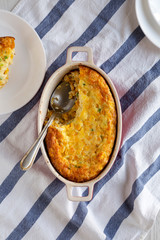 Homemade Cheddar Corn Pudding Casserole, top view. Flat lay, from above, overhead.
