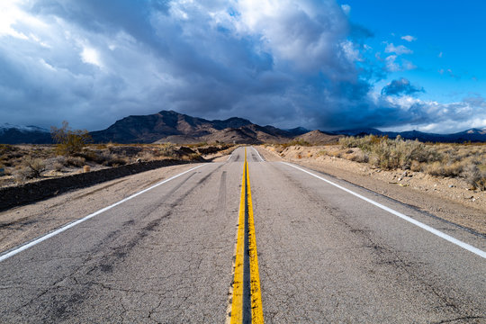 An empty road in the Mojave desert near Cima, California