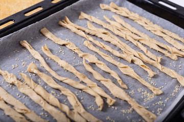 Homemade puff sticks with sesame sesame to bake