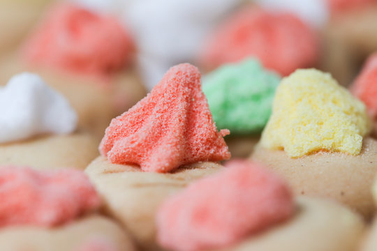 Belly button iced gem biscuits on white background