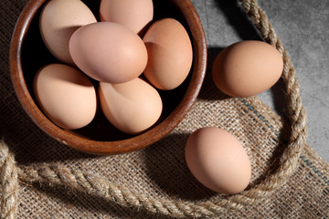 Group of of raw chicken eggs on rustic background, Organic eggs in loft style kitchen
