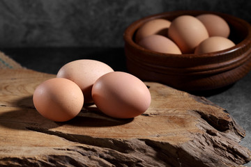 Group of of raw chicken eggs on rustic background, Organic eggs in loft style kitchen