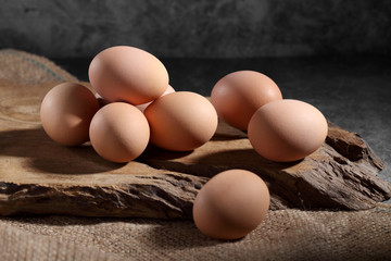 Group of of raw chicken eggs on rustic background, Organic eggs in loft style kitchen