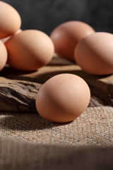 Group of of raw chicken eggs on rustic background, Organic eggs in loft style kitchen