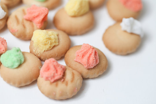 Belly button iced gem biscuits on white background