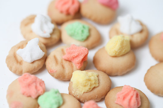 Belly button iced gem biscuits on white background