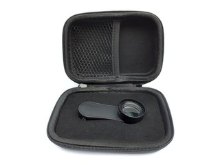 Black mobile phone macro lens with holding clip and case isolated on white background. 20x macro lens for smartphone.