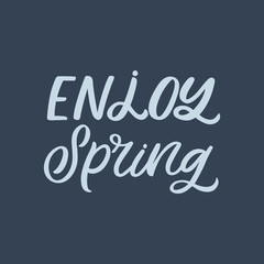 Hand drawn lettering quote. The inscription: Enjoy spring. Perfect design for greeting cards, posters, T-shirts, banners, print invitations.