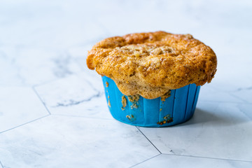 Homemade Autumn Pumpkin Muffin with Hazelnut Powder and Filled with Apple Slices.