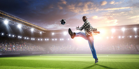 Soccer man in action with ball. Mixed media