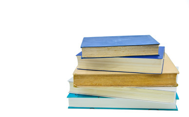 Books, stacked over one another in front of a white background