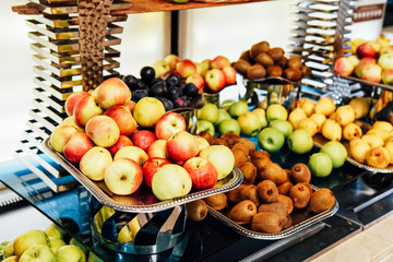 plates with fresh fruit in the kitchen citrus apples healthy food