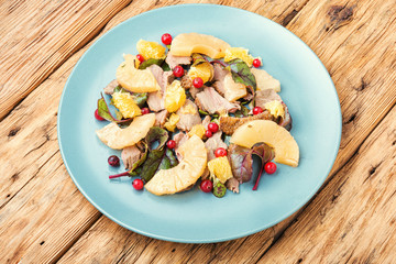 Salad with duck and pineapple