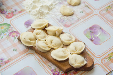 Cooking dumplings. Russian traditional cuisine.