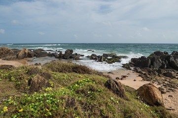 Fototapeta na wymiar Rocks on the shore of the Indian ocean, Galle, Sri Lanka