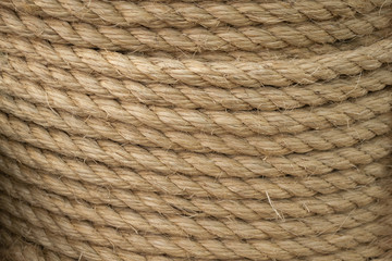 Texture of coiled sisal rope. Several layers of thick rope as background - obrazy, fototapety, plakaty