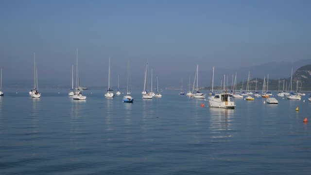 Boats and Ferry on Garda Lake, Italy. Bardolino bay area