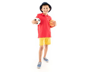 attractive young sports smiling child with a soccer ball on a white background