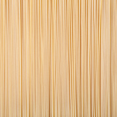 Uncooked dried spaghetti pasta background