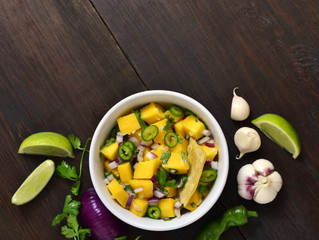Homemade Mango Salsa with Ingredients and Corn Chips,  top view, copy space