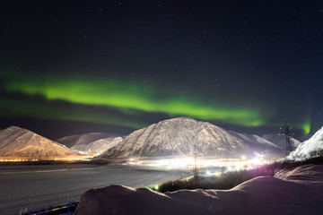 Fototapeta na wymiar Northern lights on the background-night mountains