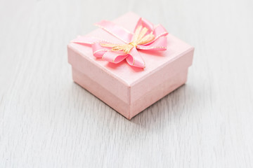 pink gift box on table wood copy space