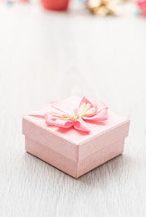 pink gift box on table wood copy space